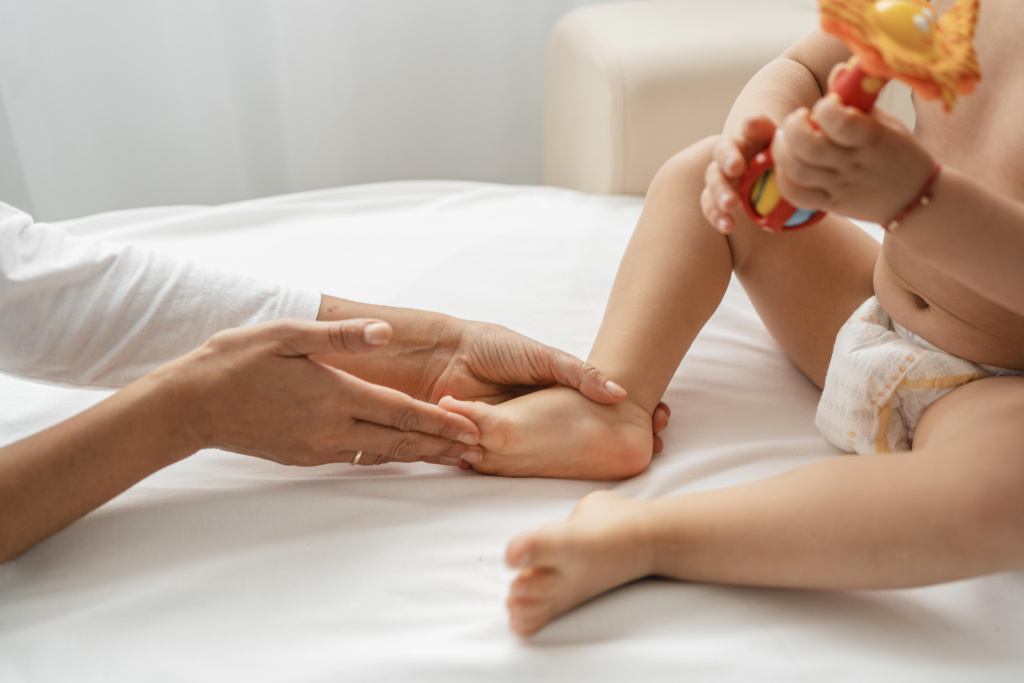 osteopathist-treating-a-baby-girl-s-feet.jpg